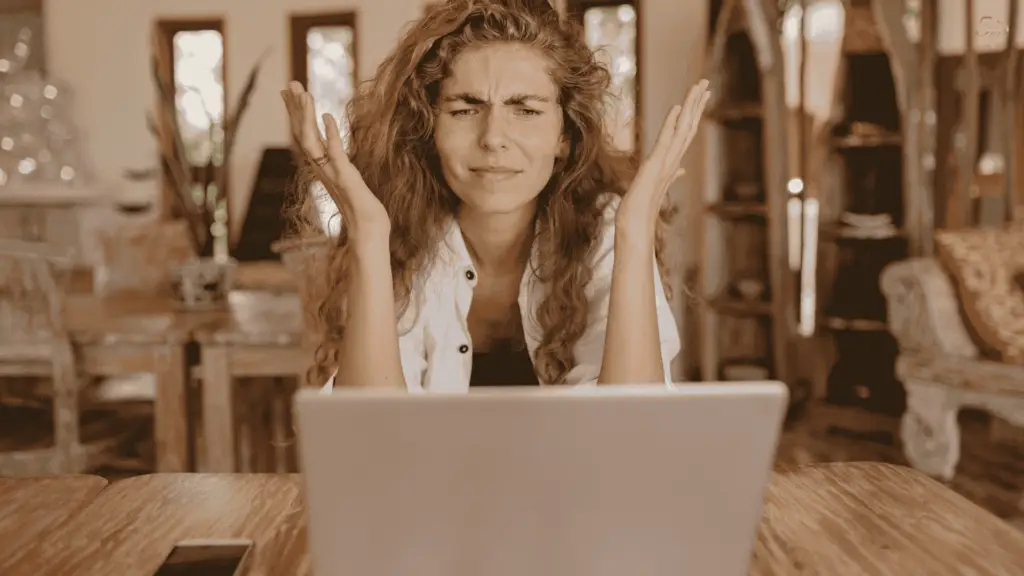 Frustrated woman struggling to write a novel—common mistakes new writers make